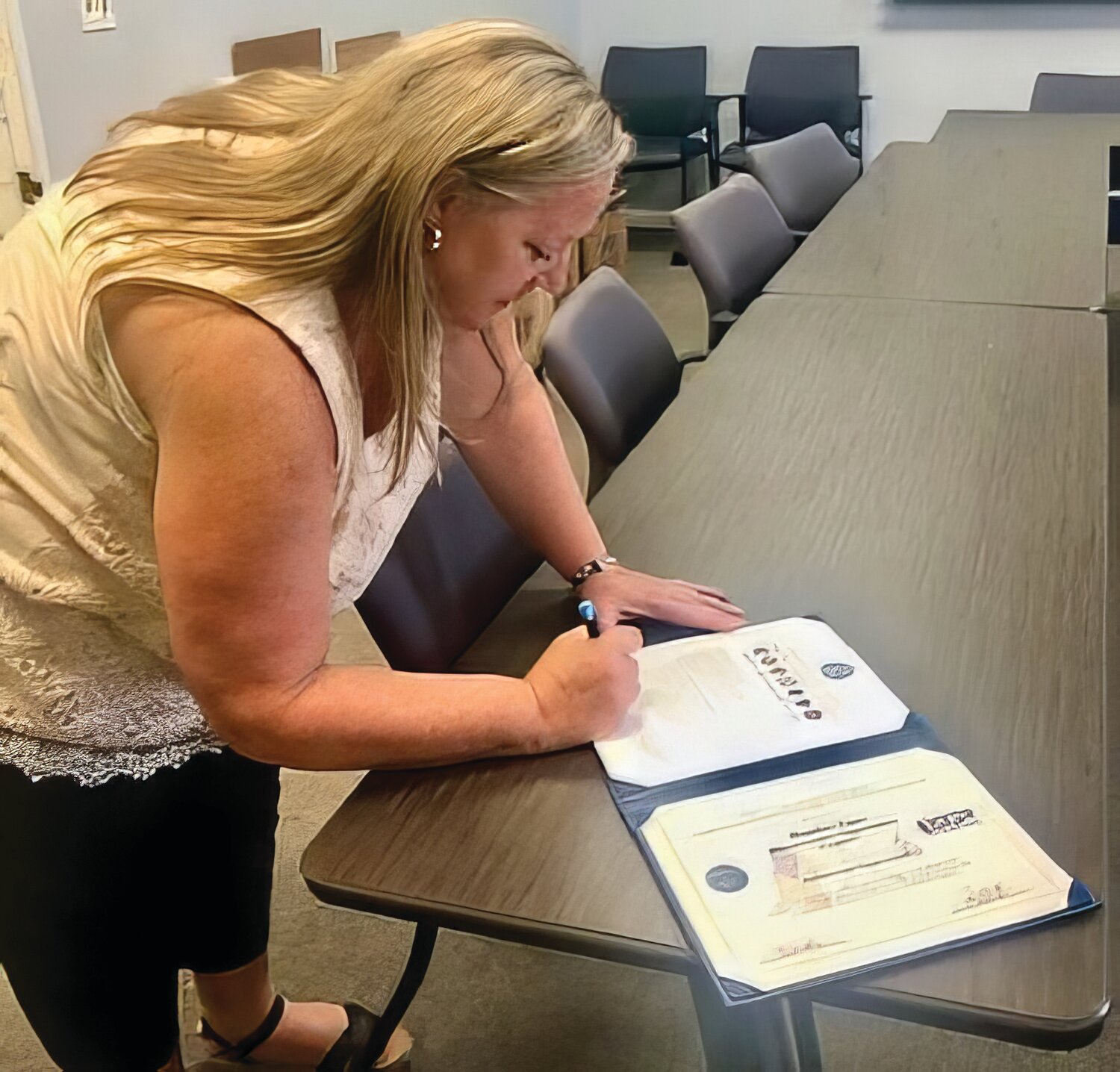 Bucks County Opportunity Council CEO Heather Lucoss signs a Statement of Support.