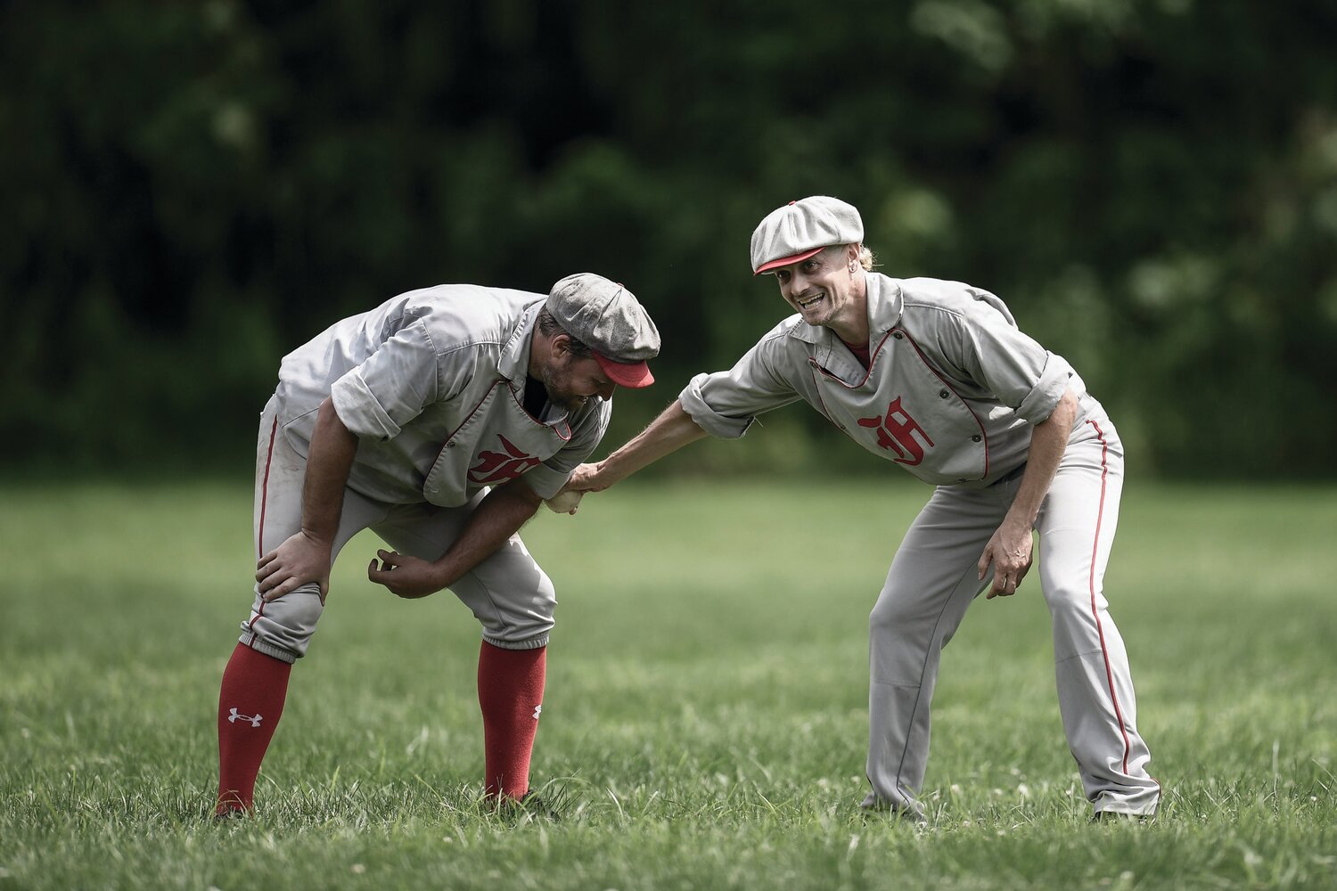 Players joke around on the field with the “hidden ball trick.”