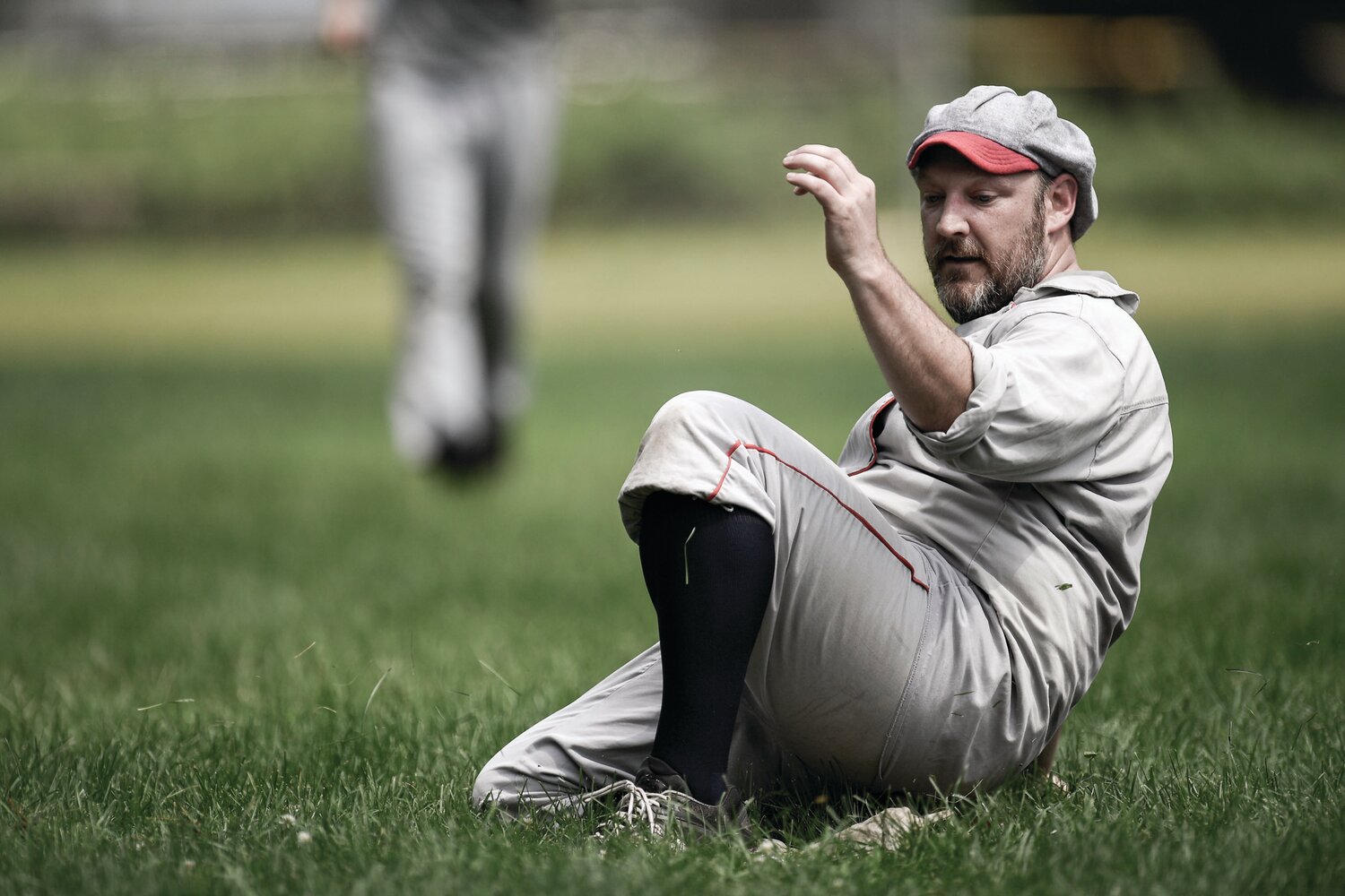 Dan “Sledge” Hammer slides into third. Bases were a cloth-filled bag with a belt wrapped around to secure it to the ground.