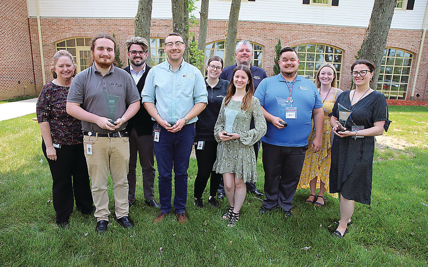 American Heritage Marketing and Business Development Team members display the Marketing Association of Credit Unions’ MAC awards.