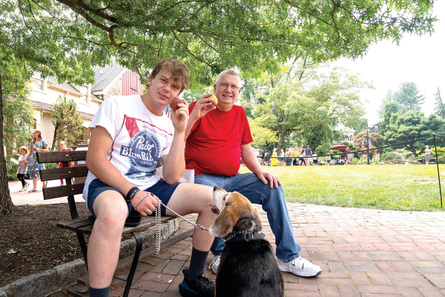 Ben and Scott Schubert enjoy ripe peaches at Peddler’s Village’s Peach Festival, held Aug. 5 and 6.