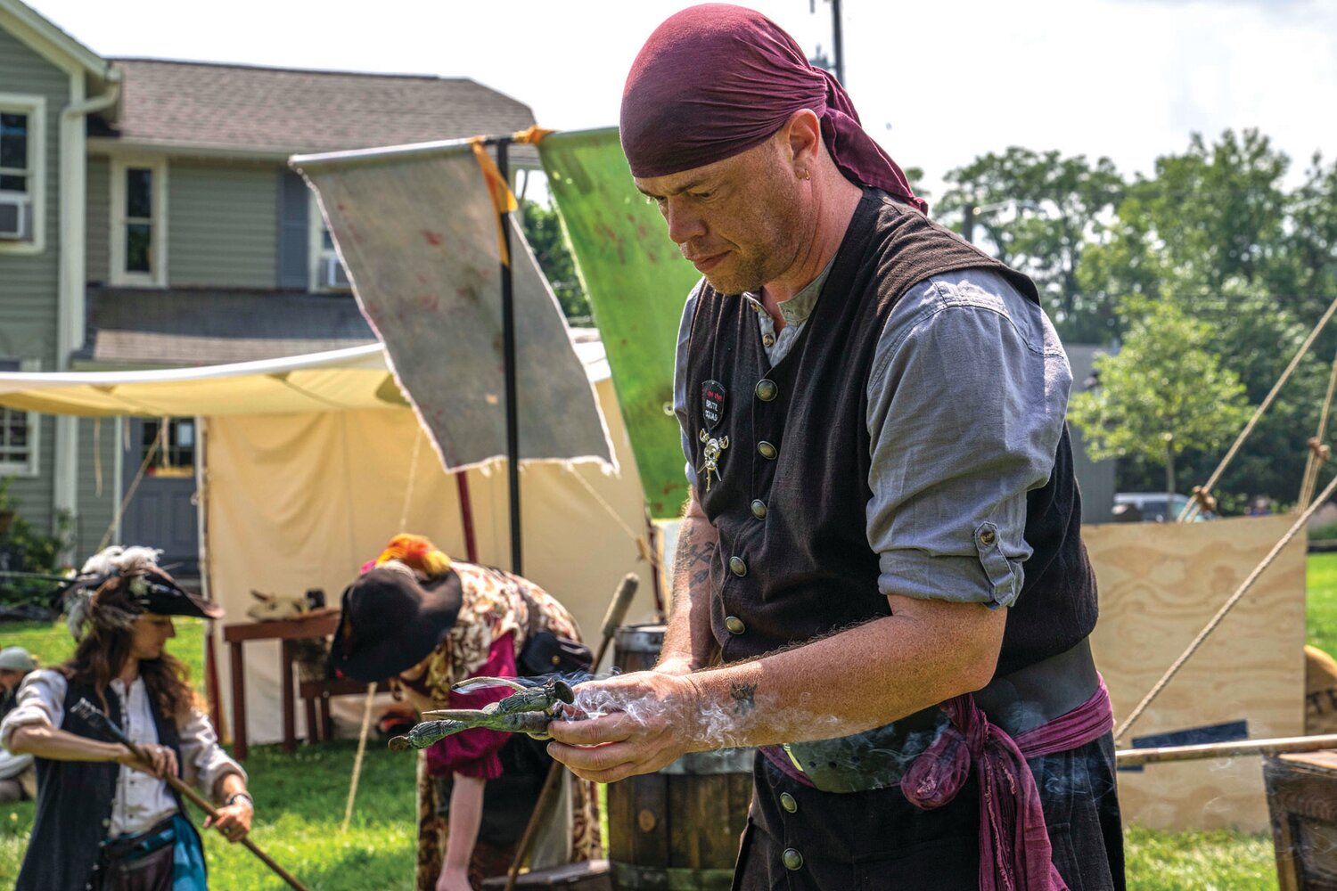 A member of the Pirates of Fortune’s Folly crew joins his mates at the Peddler’s Village 2023 Peach Festival.