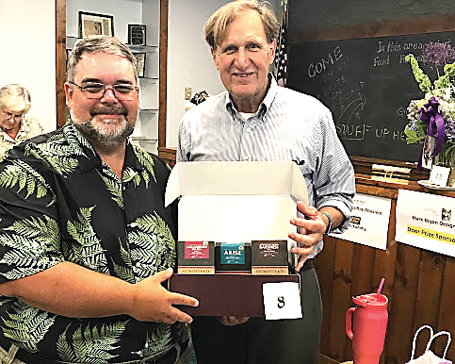 Roger Keller, Bridgeton Township supervisor, right, hands a prize to Scott Freeman, Realtor and Palisades School Board member.