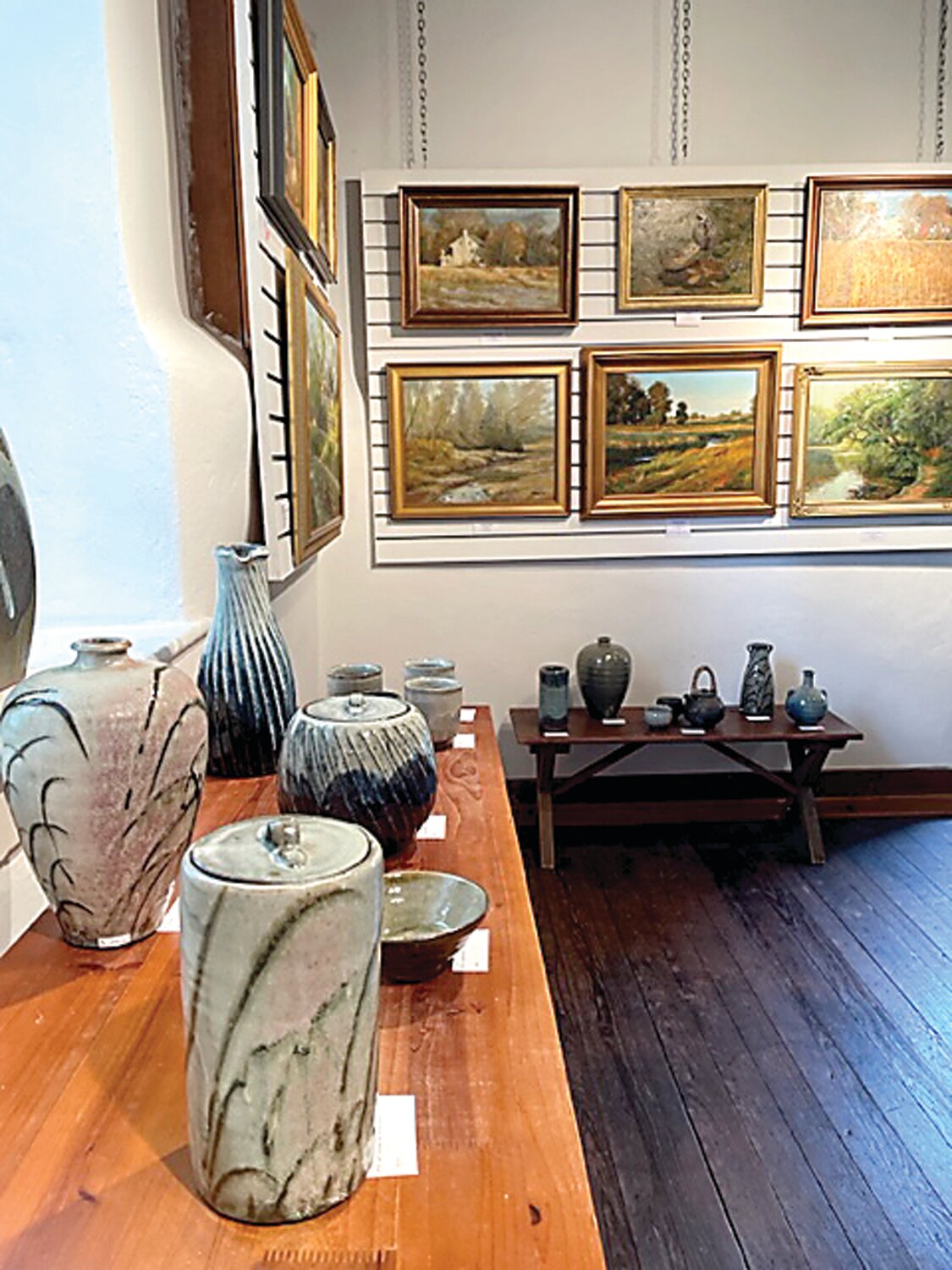 Paintings by Dot Bunn and stoneware by Willi Singleton.