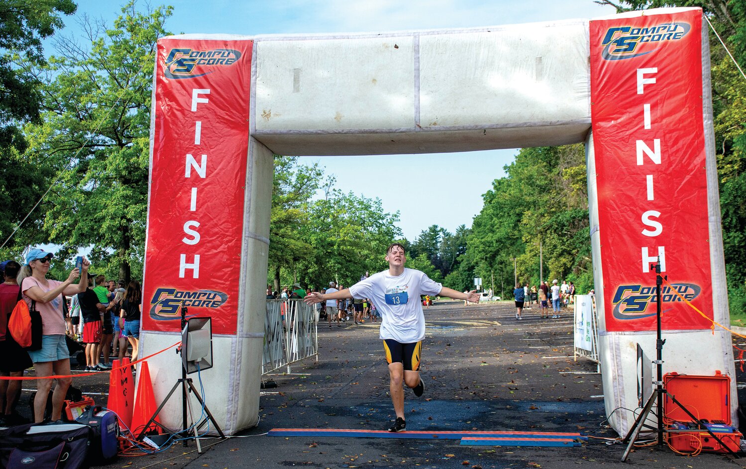 Charlie Filiatrault celebrates as he crosses the finish line.