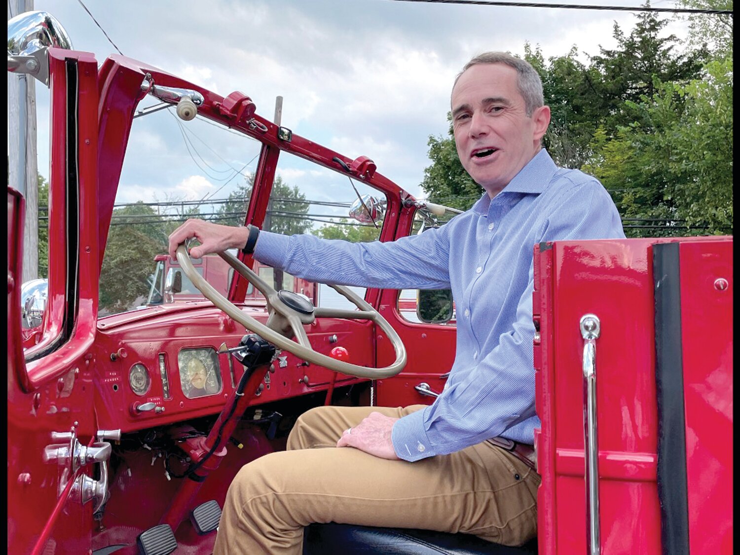 State Sen. Steve Santarsiero aboard a vintage fire truck.