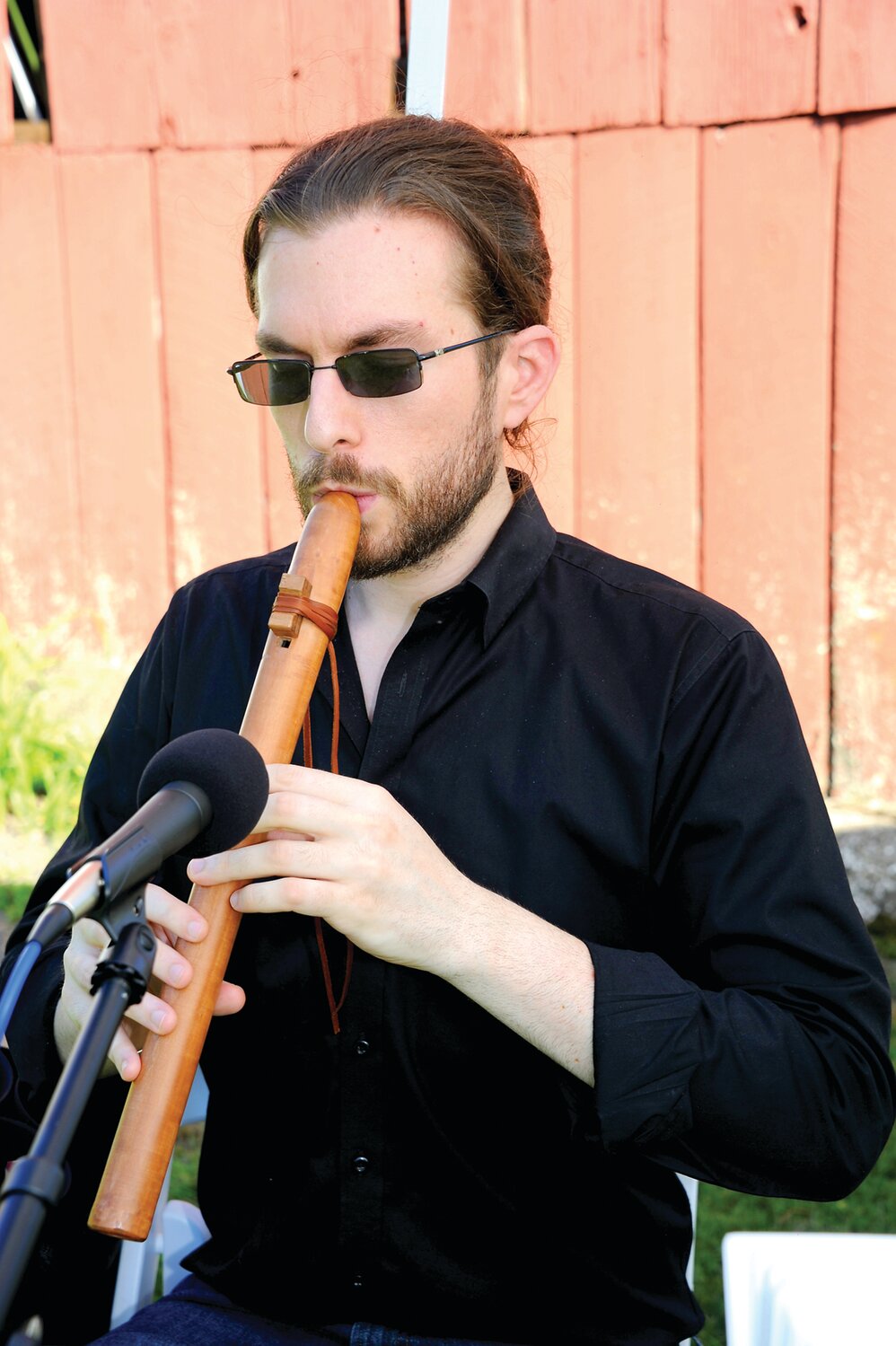 Jack Darnell plays a Native American flute.