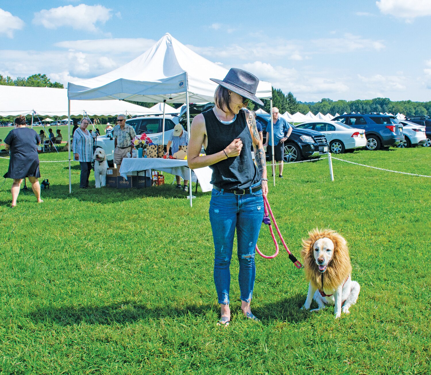 Mariah Cook and her dog Bridget, whose lion costume took third place in the costume contest.