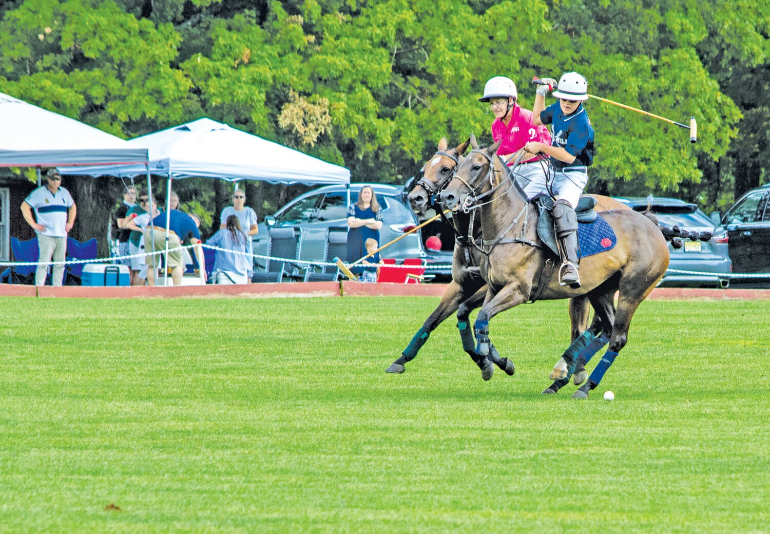 A pair of players compete in the polo match at Tinicum Park in Erwinna Aug. 26.