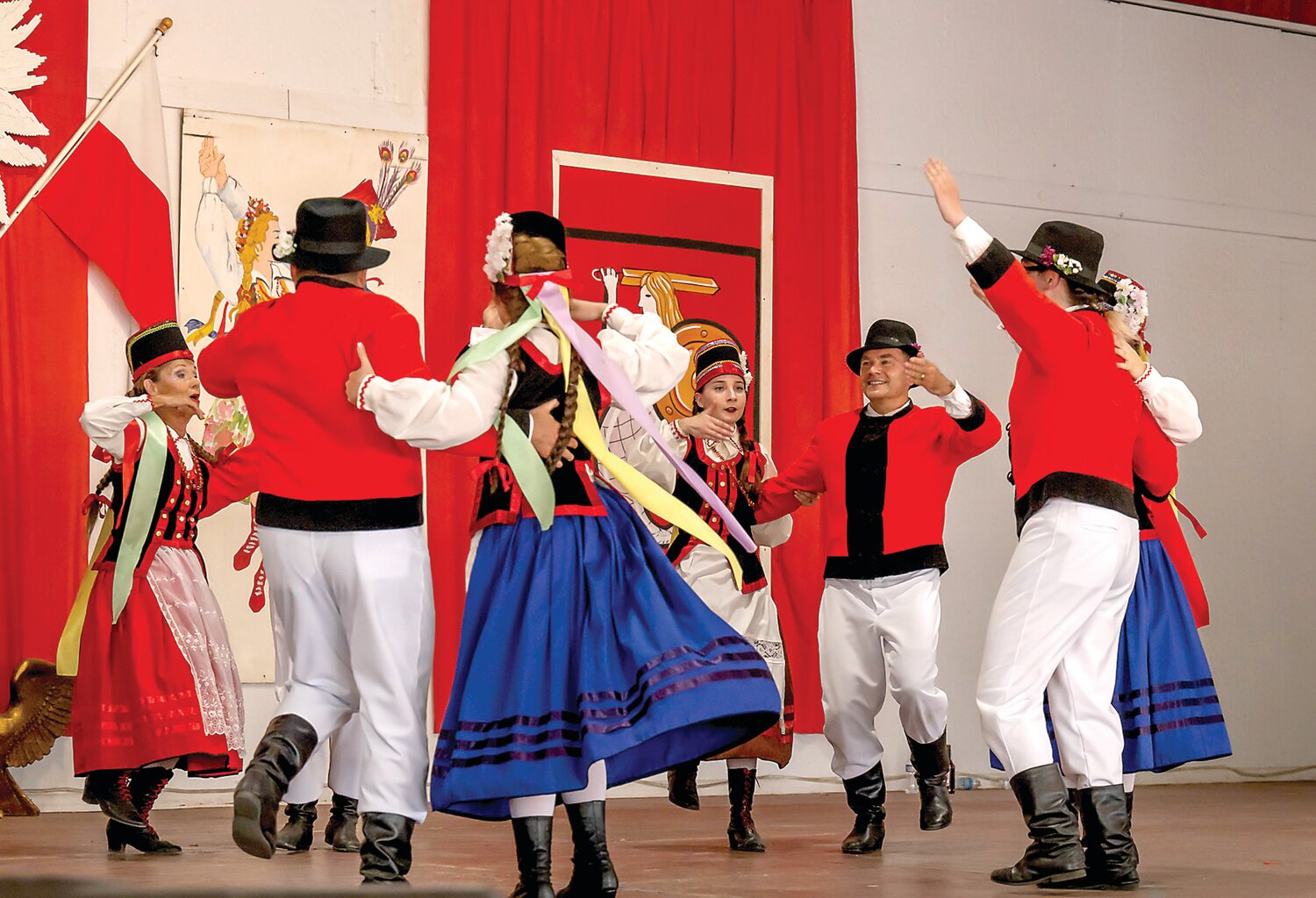 Folk dancers perform on stage at the Polish American Family Festival & Country Fair.