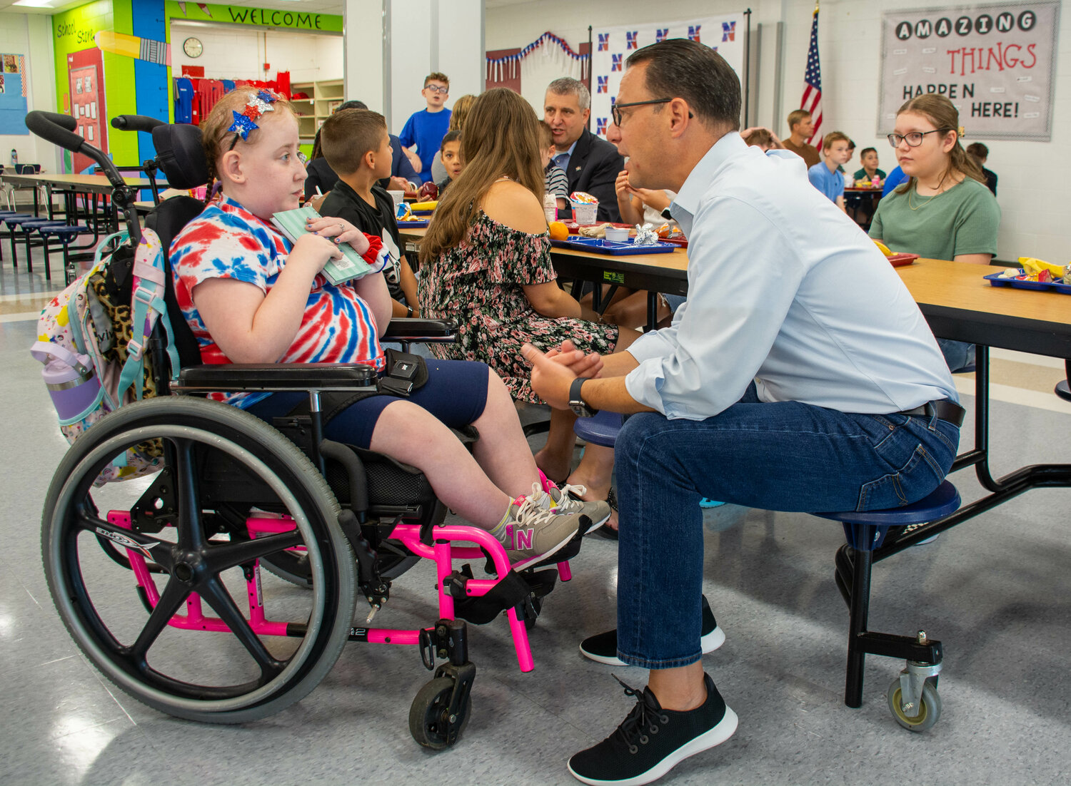 Gov. Shapiro talks with 5th grader Emma Reed at Maple Point Middle School. The governor was at the school to talk about the state’s free universal breakfast program.