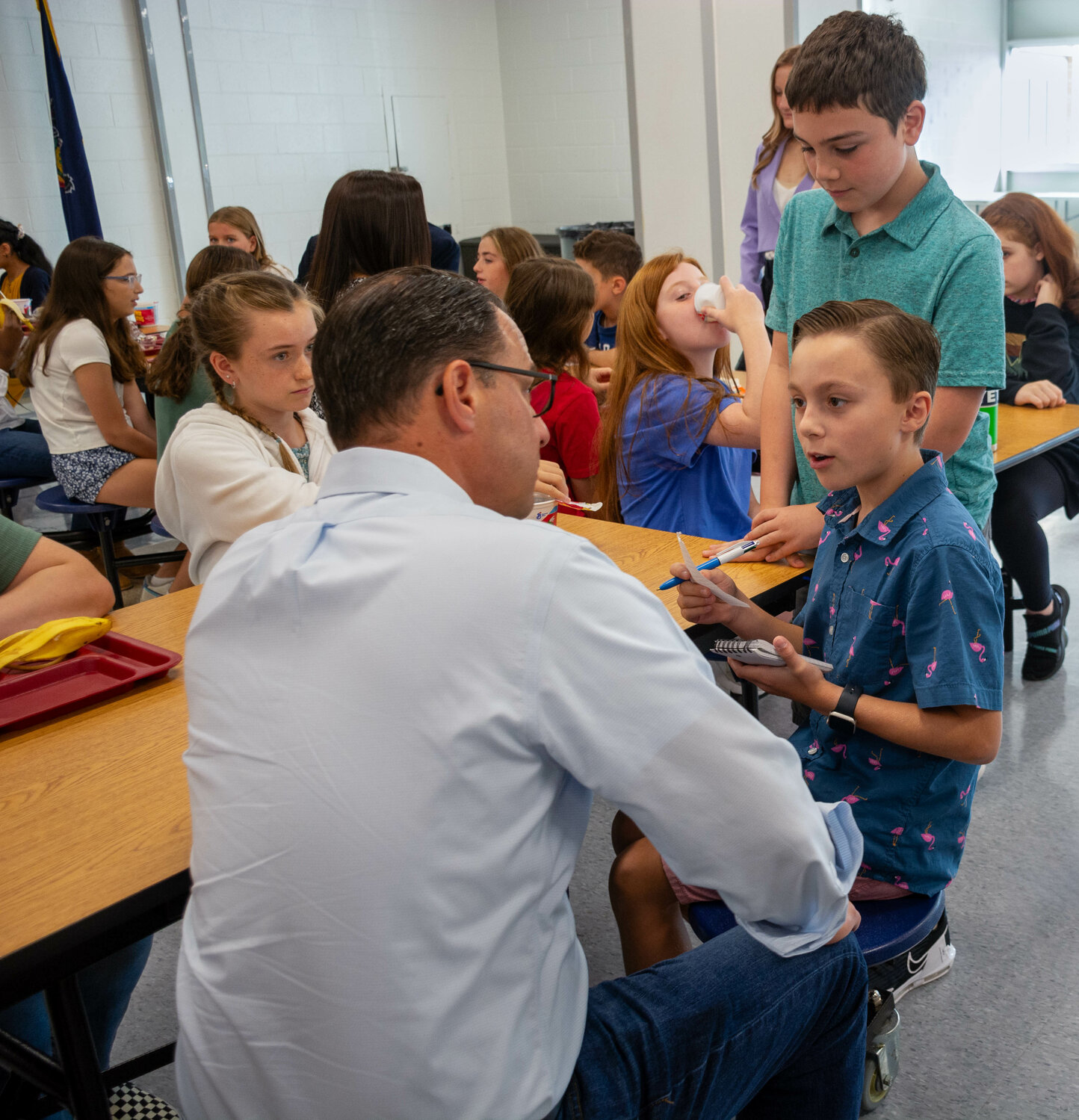 Maple Point Student Ryan McSherry interviews Gov. Josh Shapiro as   Grayson Leach looks on.