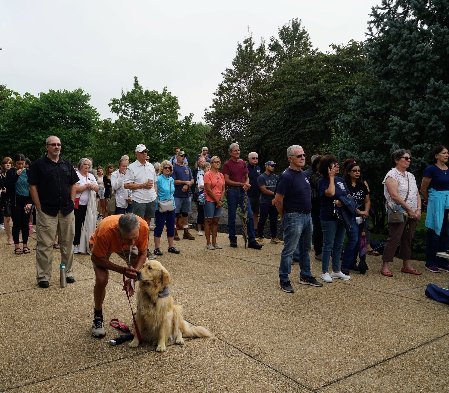 Residents gather at The Garden of Reflection Monday to mark the anniversary of the terrorist attacks of Sept. 11, 2001.