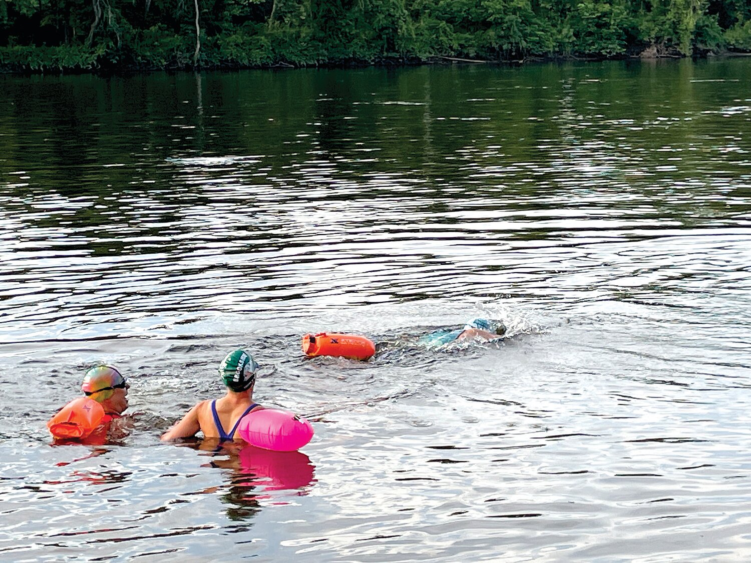 Michael Karl, right, begins his journey on the Delaware as Wendy Pippin Fesmire, left, and Julie Titcomb Wittemore look on.