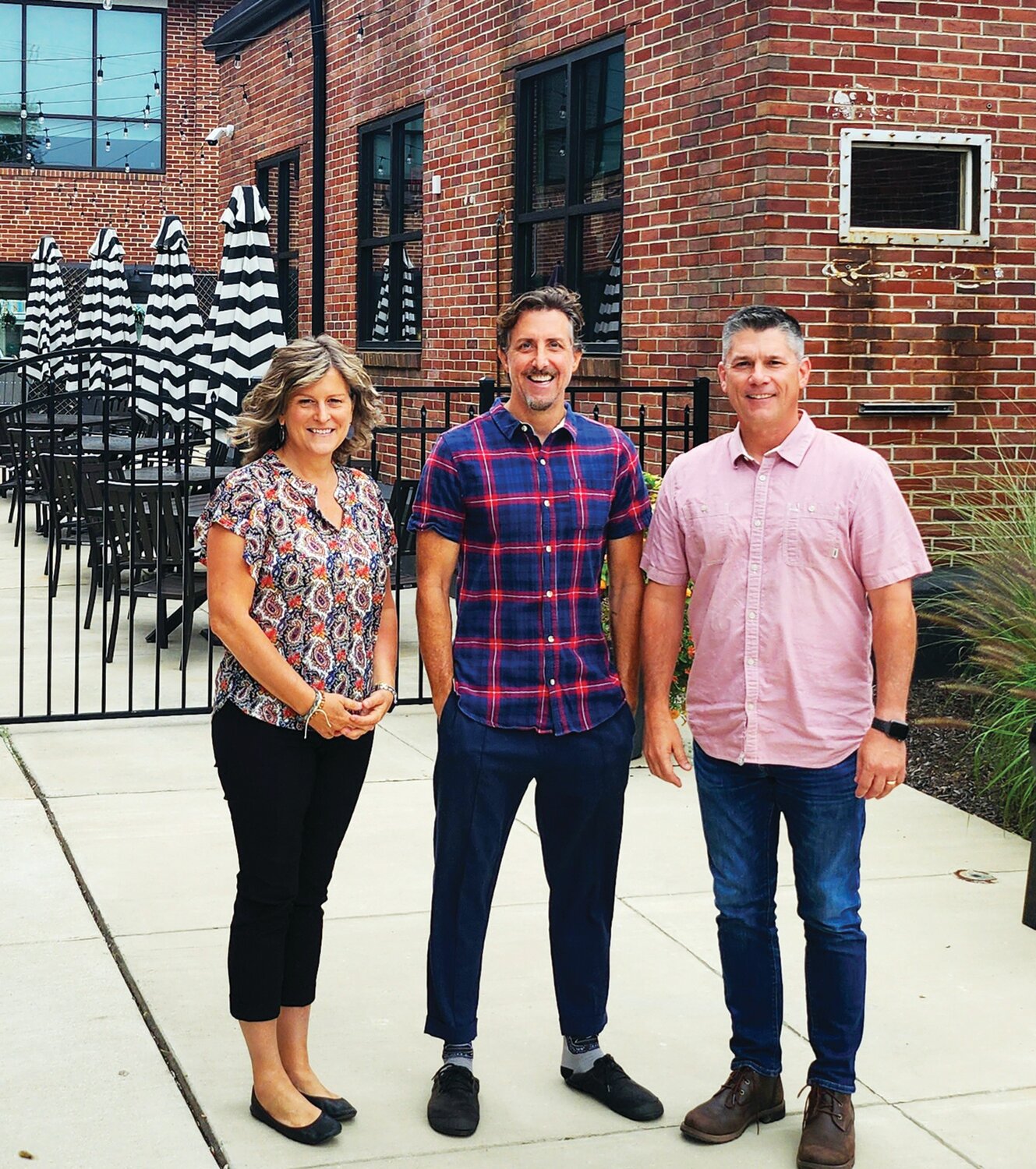 From left are: Corinna Garis, director of marketing, Dublin Town Center; Keith Fenimore, founder, Main St.; and  Robert G. Lougher, president, Nehemiah Development Company Inc.