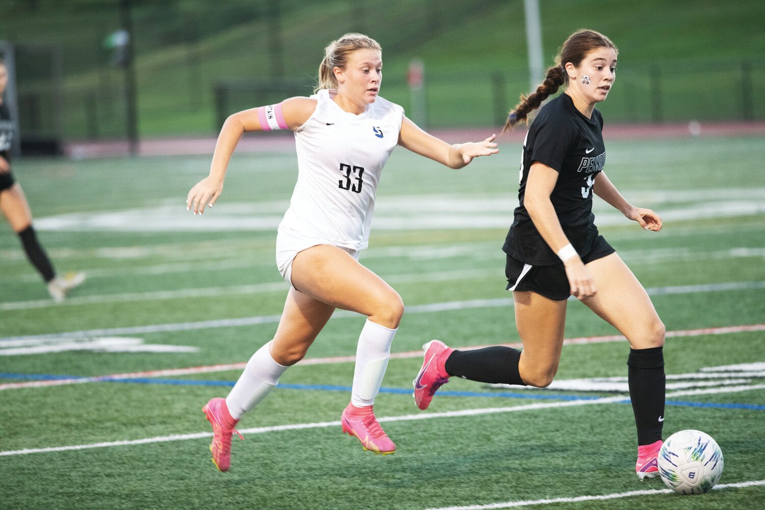 Central Bucks South’s Olivia Wade gives chase during Monday’s Titans-Rams game.