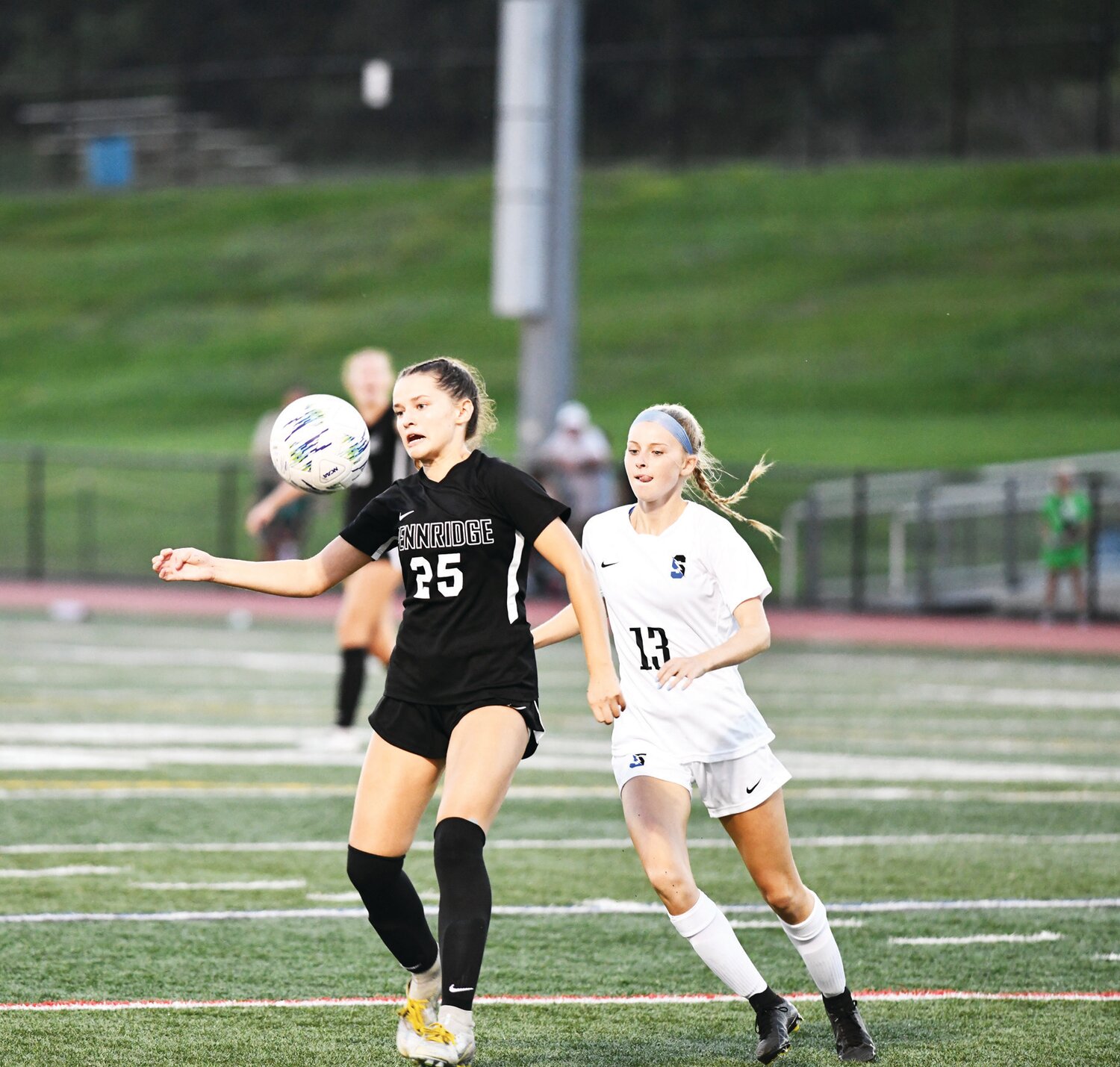 Pennridge midfielder Sophie Craig battles Kila Kienzle for possession of the ball.