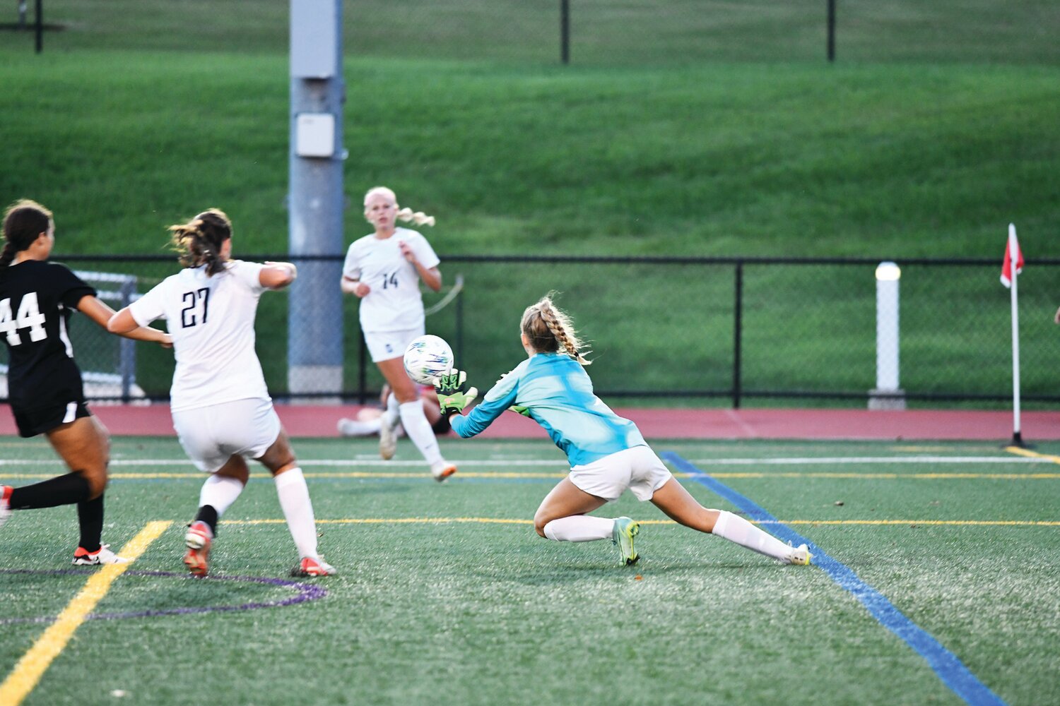 Pennridge goalkeeper Olivia Buckman deflects a shot.