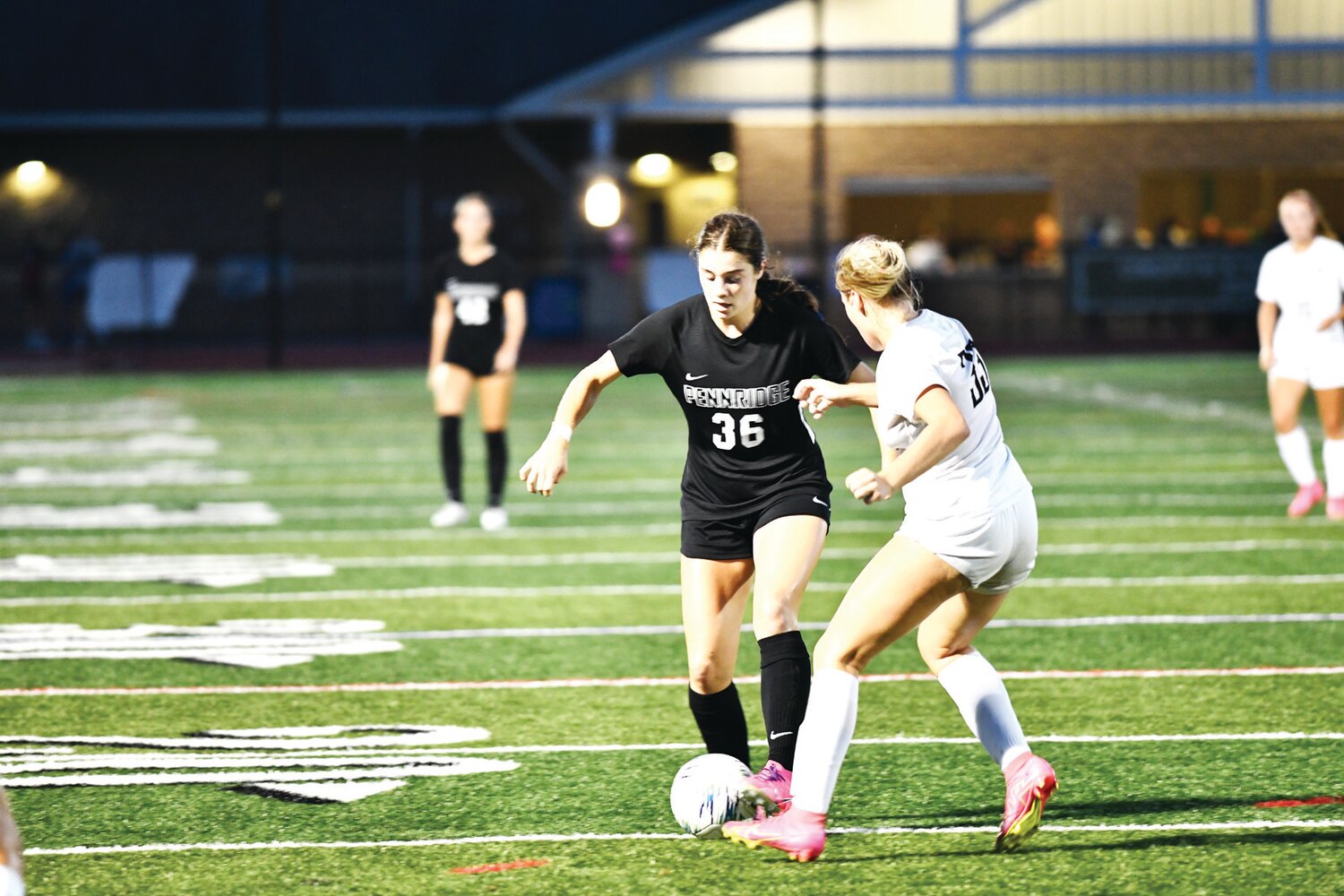 Pennridge’s Olivia Grenda fights for possession.