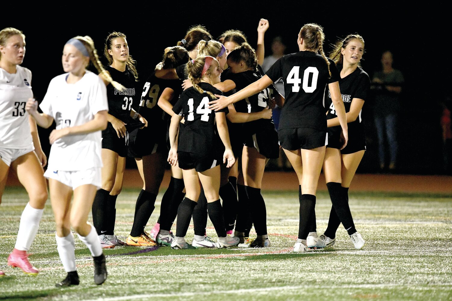 Pennridge players celebrate after scoring one of their five goals in Monday’s game.