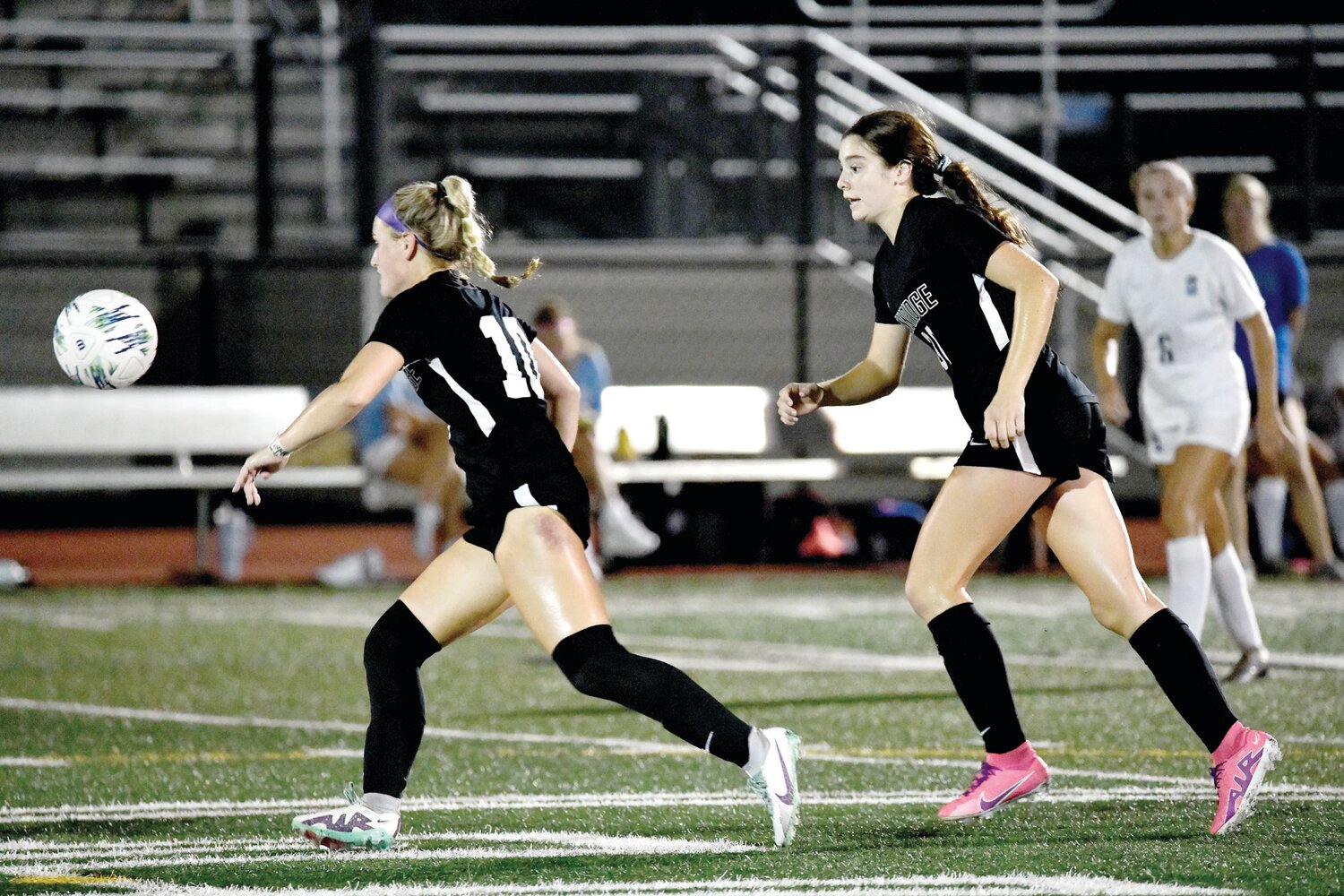 Pennridge's Jessie Moylan watches the ball as it lands at her feet, then drop kicks it down field.