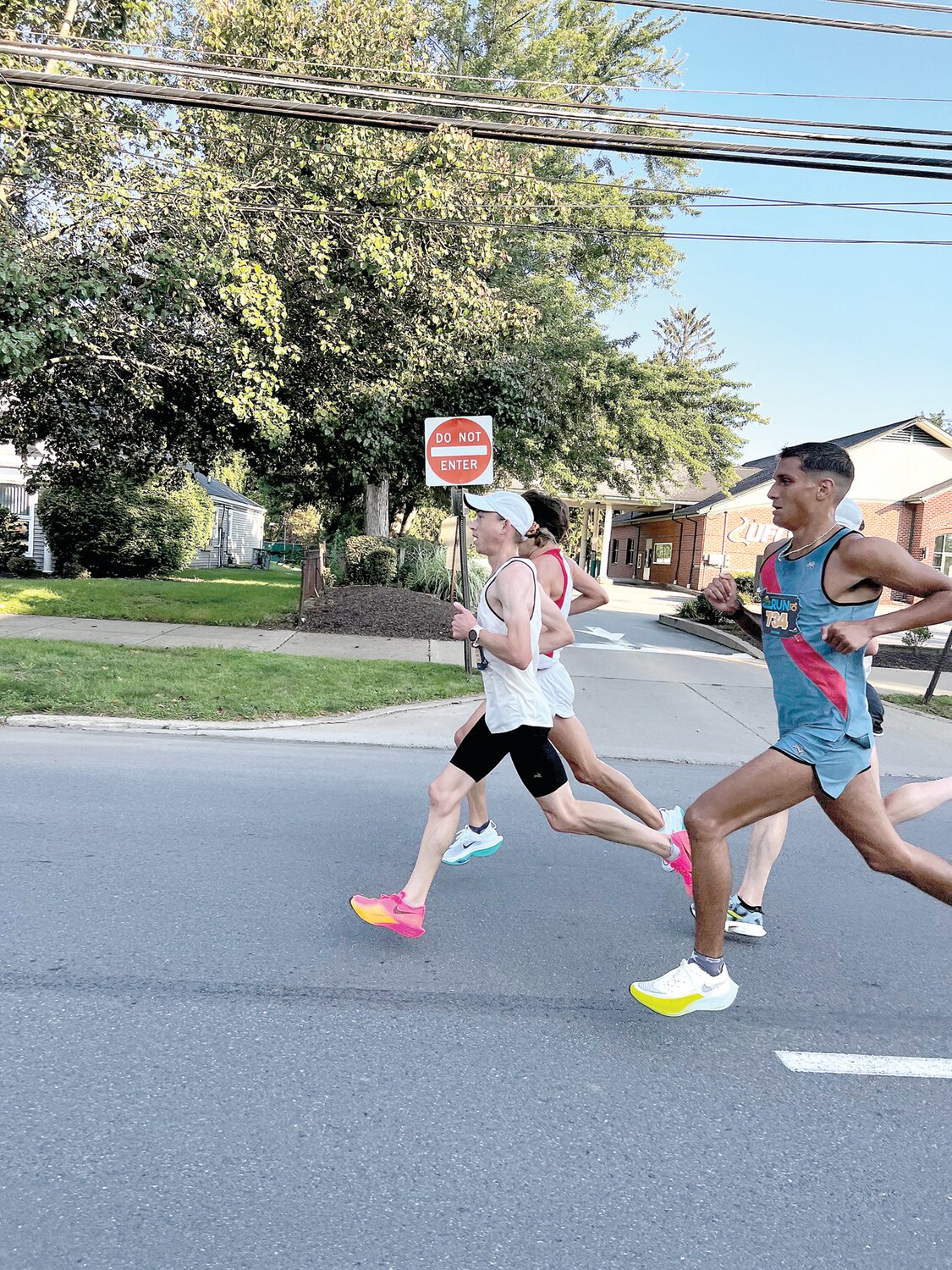 Josh Izewski, white singlet, en route to his victory in the Wyoming Valley 10-mile run this summer.