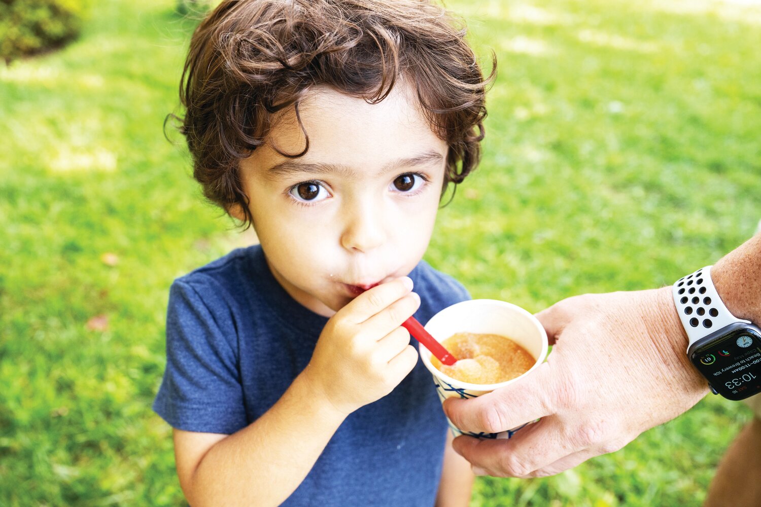 Edison Palladino enjoys an apple slushie at Solebury Orchards Saturday.