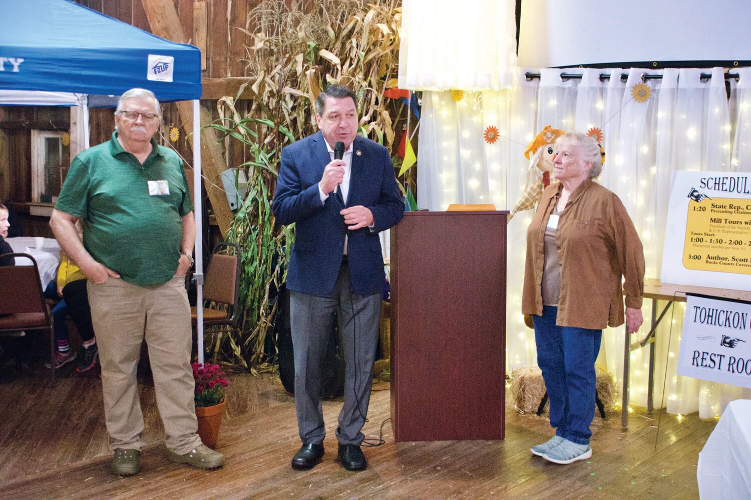 From left, Hayock Historical Society President Dave Guttman, state Rep. Craig Staats and Bernie DuBois, a member of the Friends of the Bridge, take part in a ceremony recognizing the covered bridge’s 150th birthday.