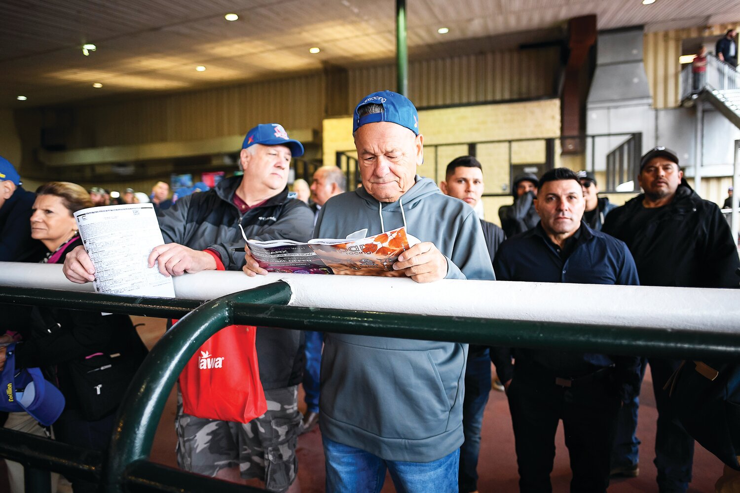 Patrick MaGee, left, and Marty Ott of New Jersey plan their picks before race No. 7.