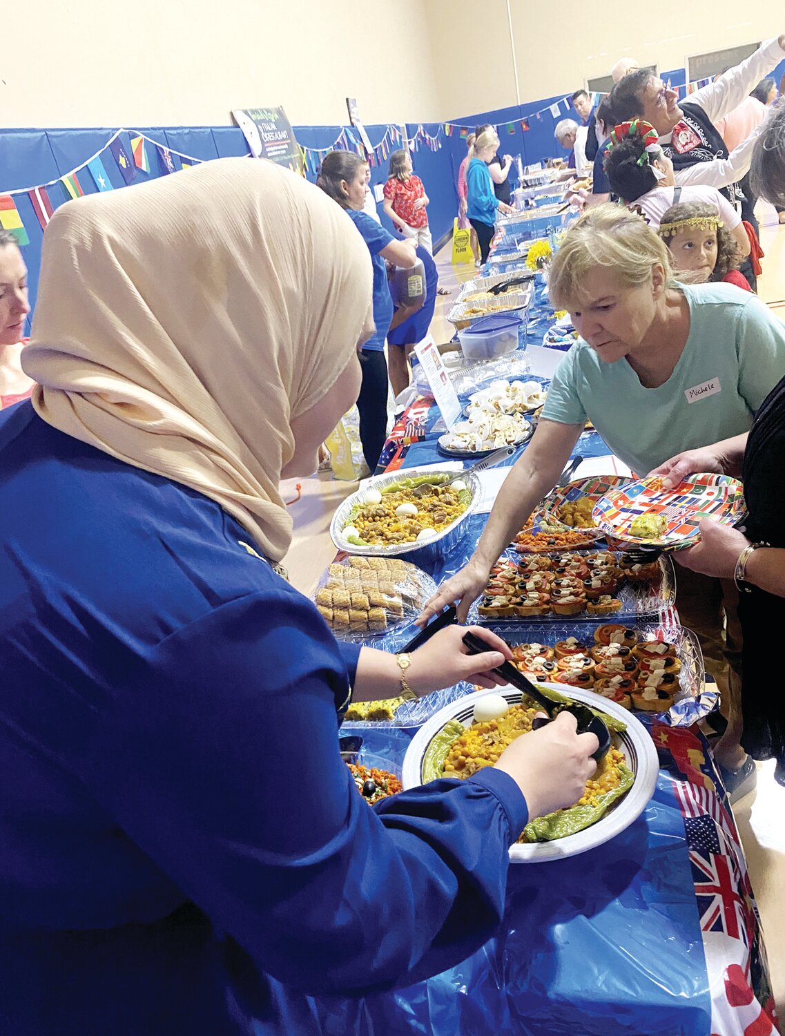 Attendees sample authentic Tunisian food at the first Welcoming Week International Potluck event held at the Quakertown branch of YMCA of Bucks and Hunterdon Counties on Sept. 8.