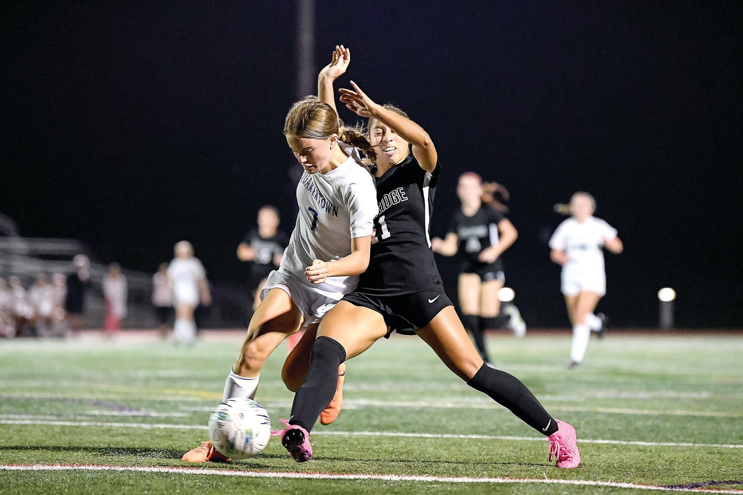 Pennridge’s Caitlyn Peace gets a foot in to knock a pass away from Quakertown’s Anna Greenday during the second half of Monday’s game.