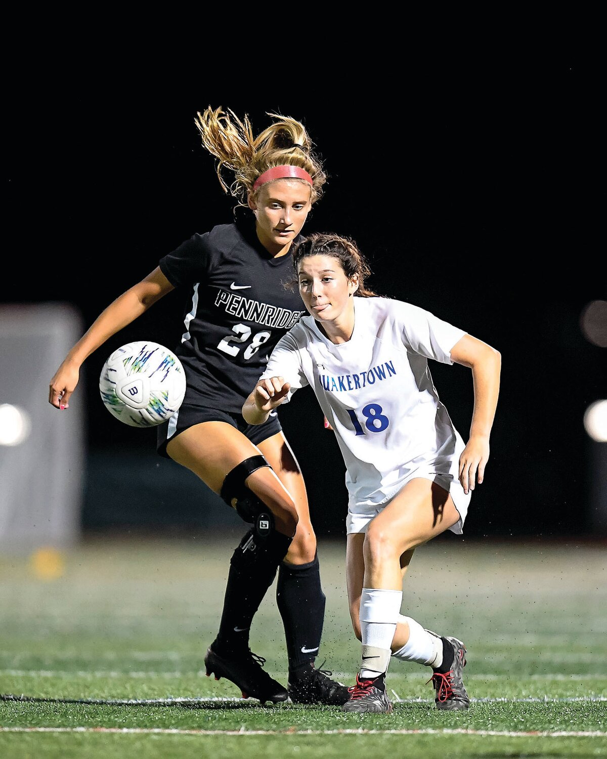 Quakertown’s Ashlyn Calabria gets in front of Pennridge’s Jenna Gagliardi to block a pass.