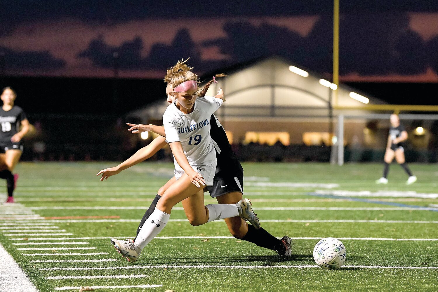 Quakertown’s Jewel Renshaw intercepts a pass intended for Pennridge’s Casey Malone in the first half.