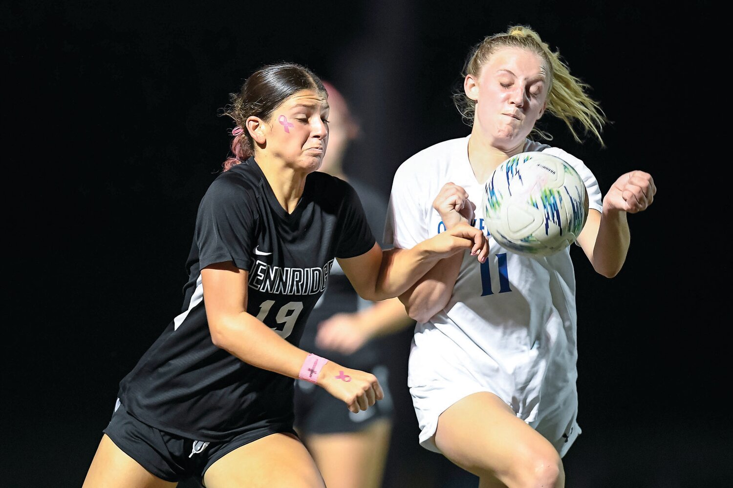 Pennridge’s Meredith Blannett and Quakertown’s Grace Maceri battle for a loose ball.