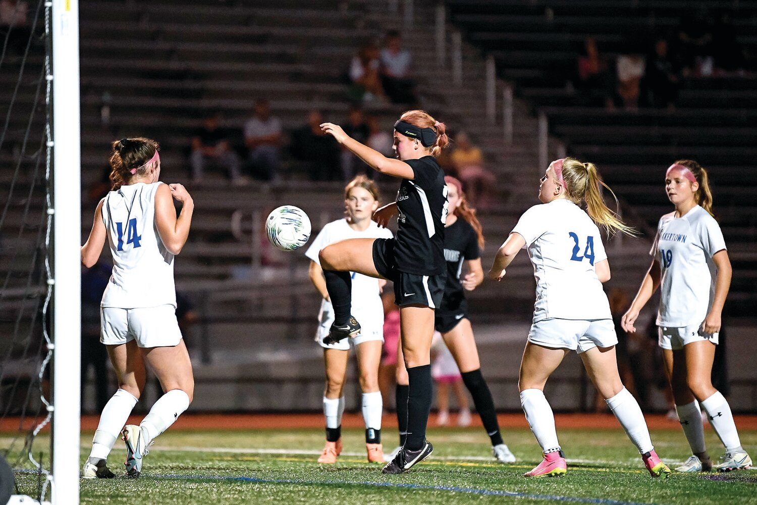 Pennridge’s Gabriella Howley gathers a loose ball in front of the Quakertown net to score the fourth goal of the game Monday night.