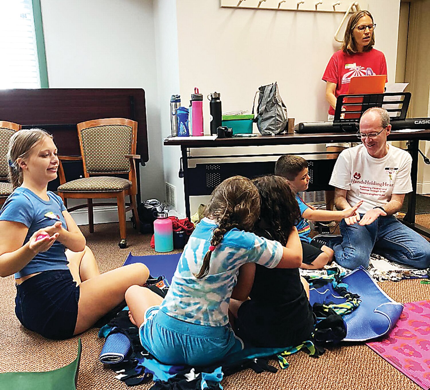 Music fills one of the rooms where Hands Holding Hearts runs its bereavement camp.