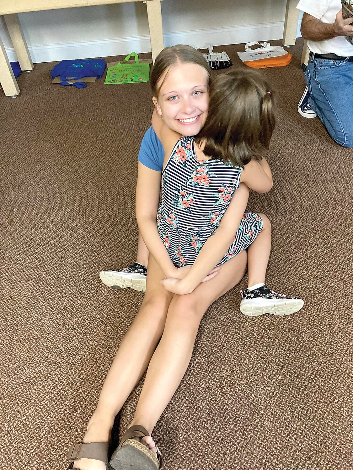 Campers embrace during an activity at Camp Feeling Better in Newtown. Run by the nonprofit Hands Holding Hearts, the camp is for children who’ve experienced the death of a significant person in their lives.