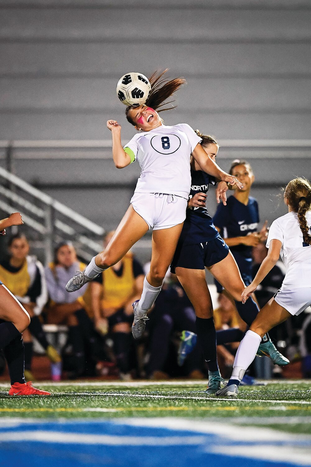 Council Rock South’s Cameron Blatz beats Council Rock North’s Audrey Thomson with a header to redirect a pass.