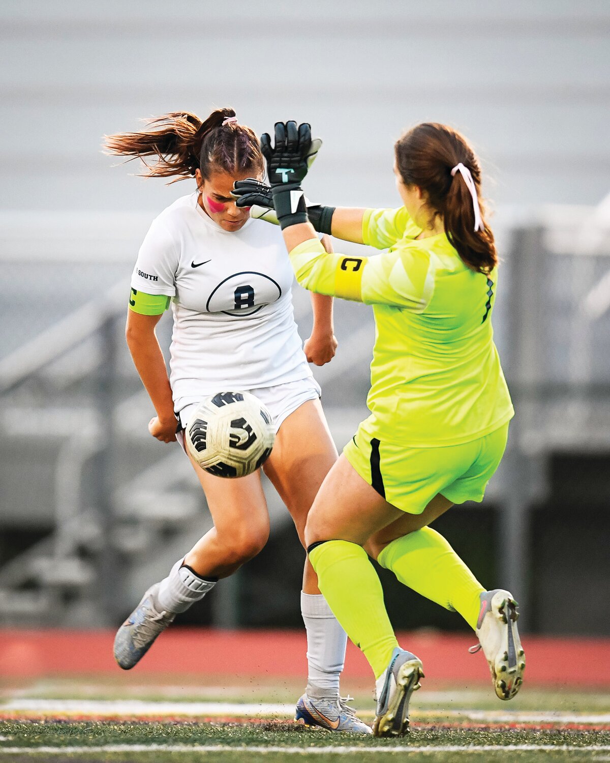 Council Rock South’s Cameron Blatz has her shot blocked by a charging Council Rock North goalie Mairin Coghlan early in the first half.