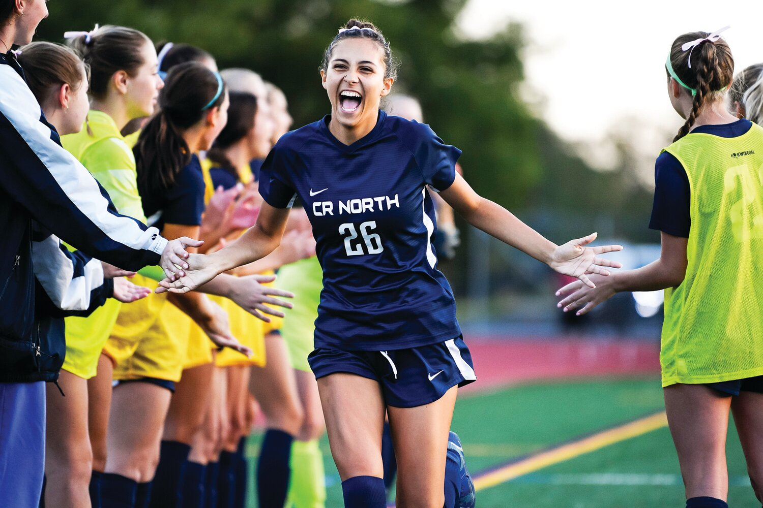 Council Rock North’s Ottavia Copestick slaps hands with her teammates during introductions of the starting lineup.