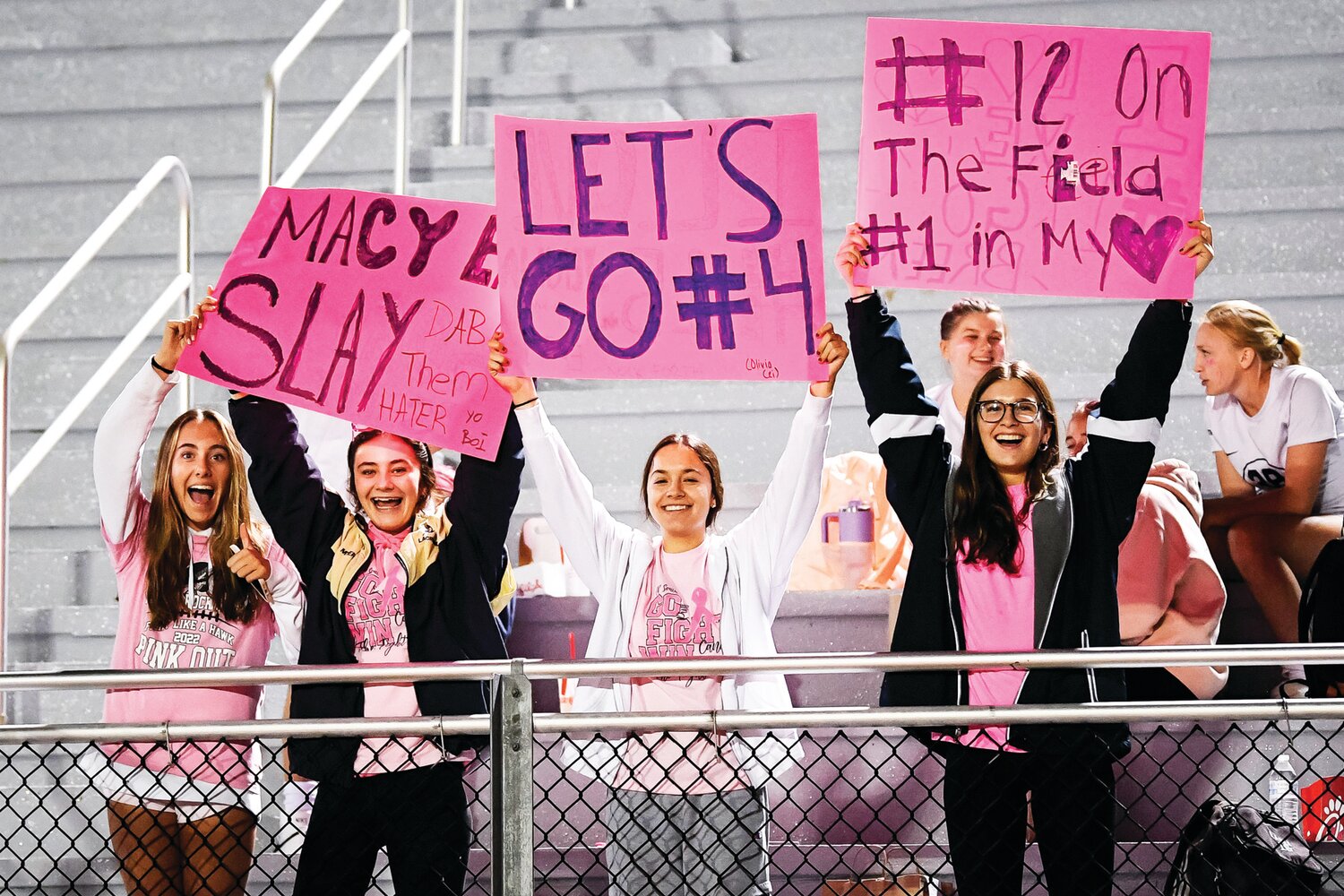 Supporters cheer on players as the game gets underway.