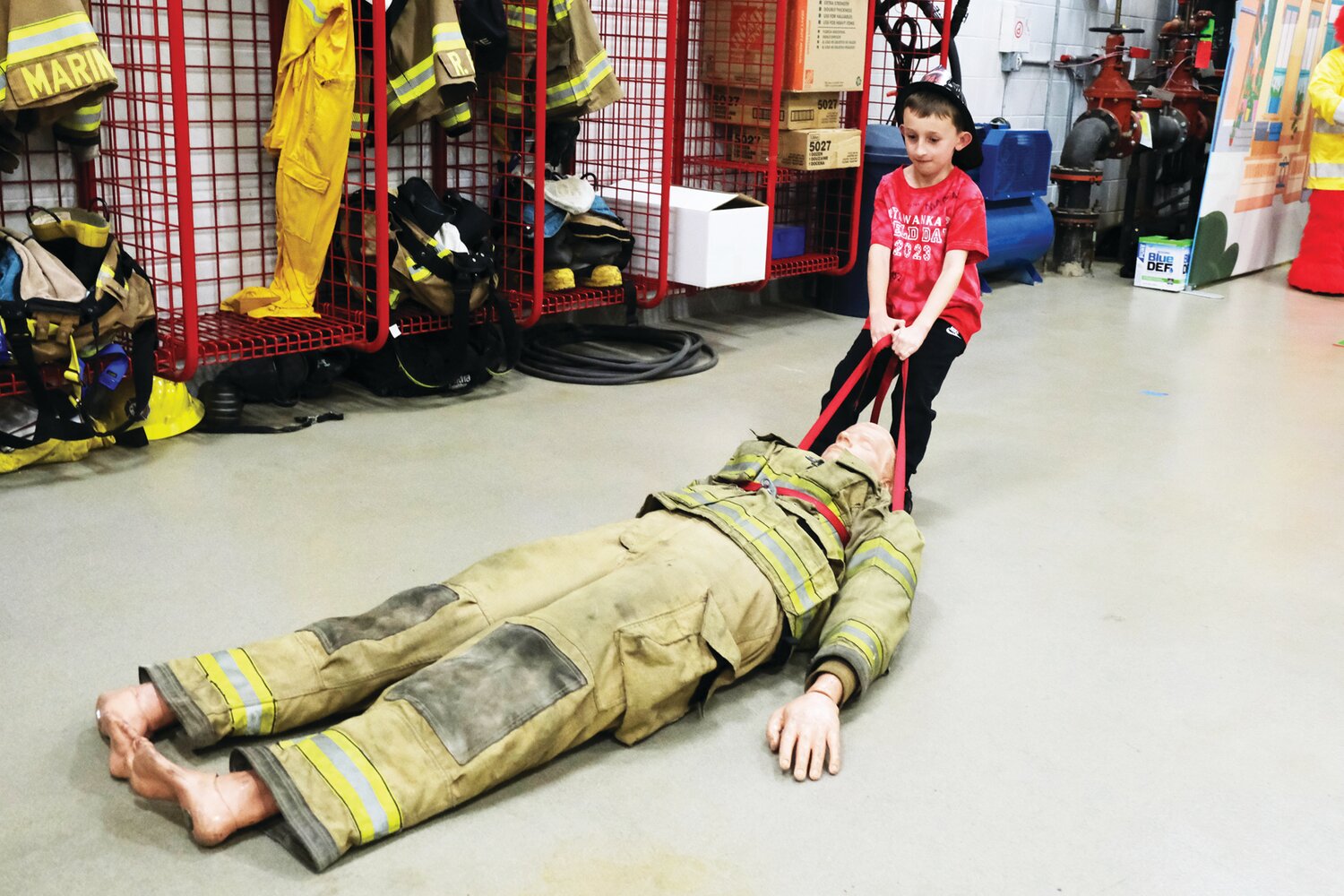 Eight-year-old Jude Todd does the body drag at Langhorne-Middletown Fire Company Station 22.