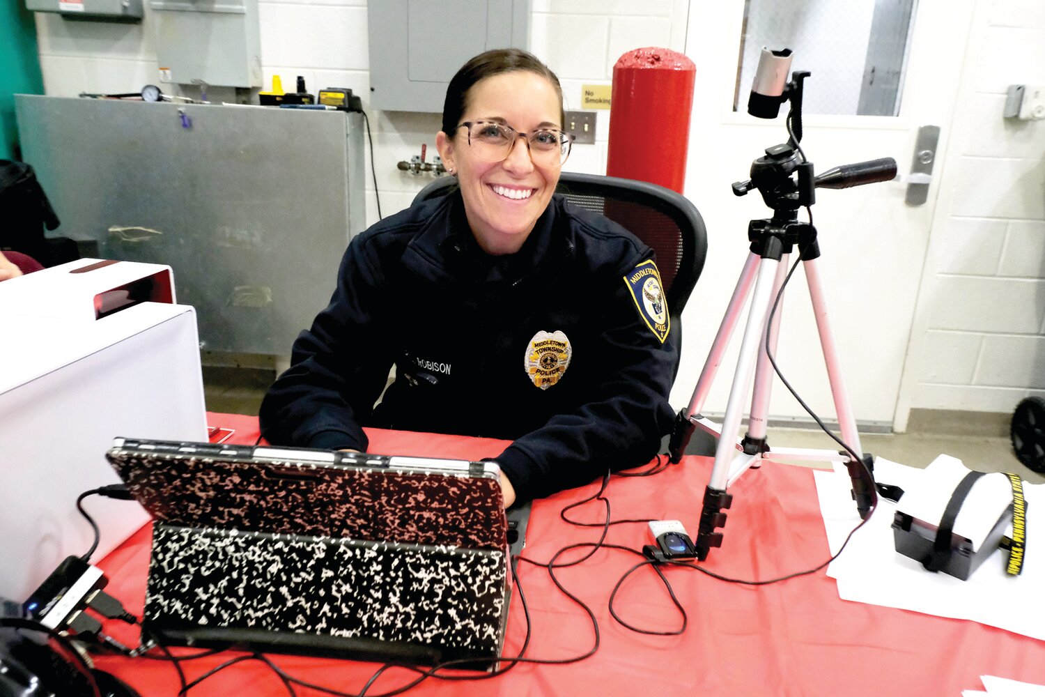 Officer Melissa Robison makes ID cards for the children that attended the Oct. 12 open house at Langhorne-Middletown Fire Company.