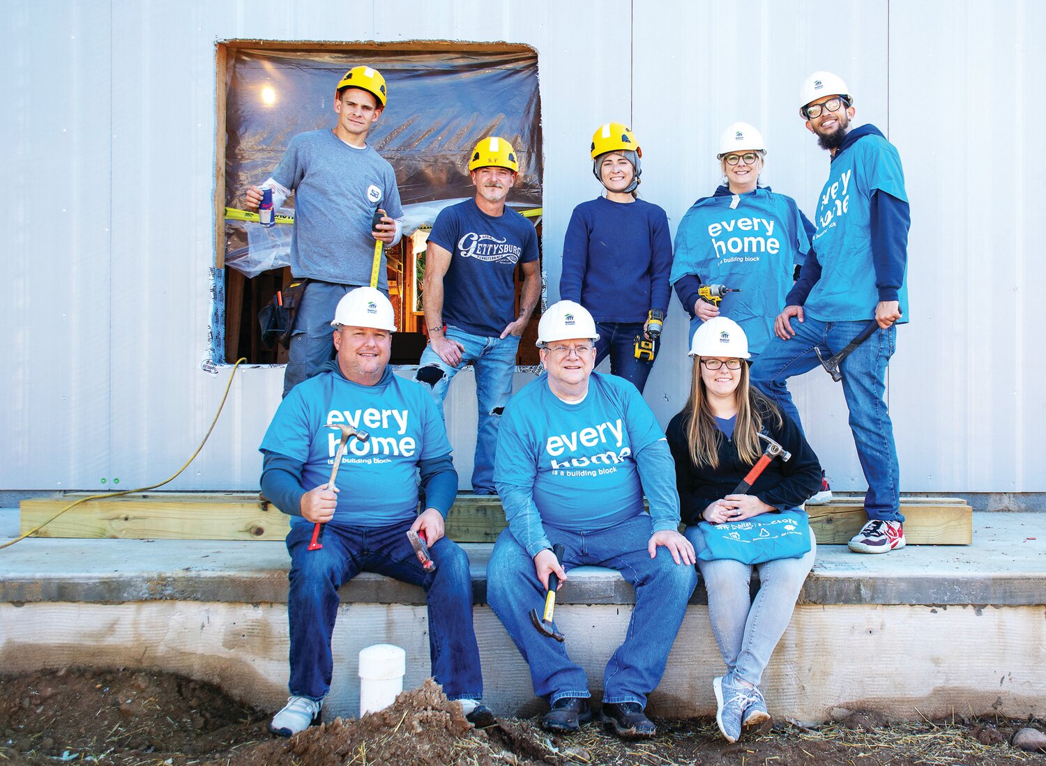 From left are: back row, Joey Lyons, Robert Piazza and Katey Smyth, Habitat for Humanity of Bucks County; volunteers Terri Reif and Devon Laidler; front row, volunteers Tim Soles, David Abernethy and Kristina Van Hart.