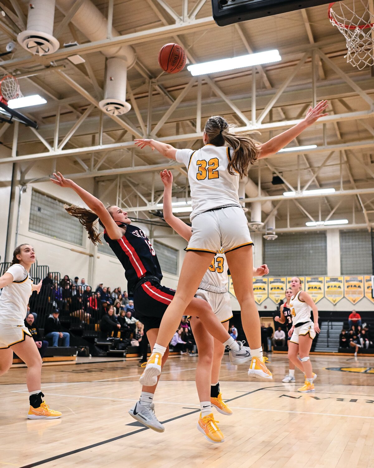 Central Bucks East’s Haley Moran drives to the basket and has her shot blocked by CB West’s Gabrielle Reichner.