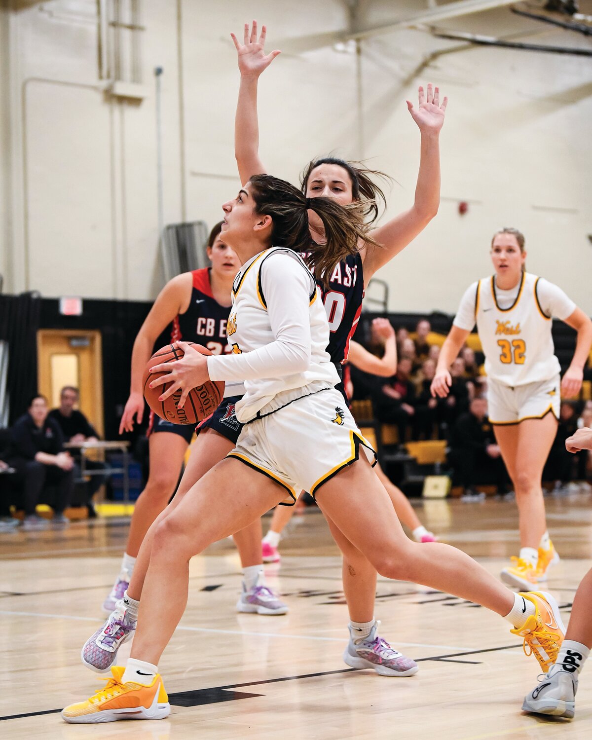 Central Bucks West’s Gabi Senior tries to drive to the basket around the defense of Central Bucks East’s Anna Barry.