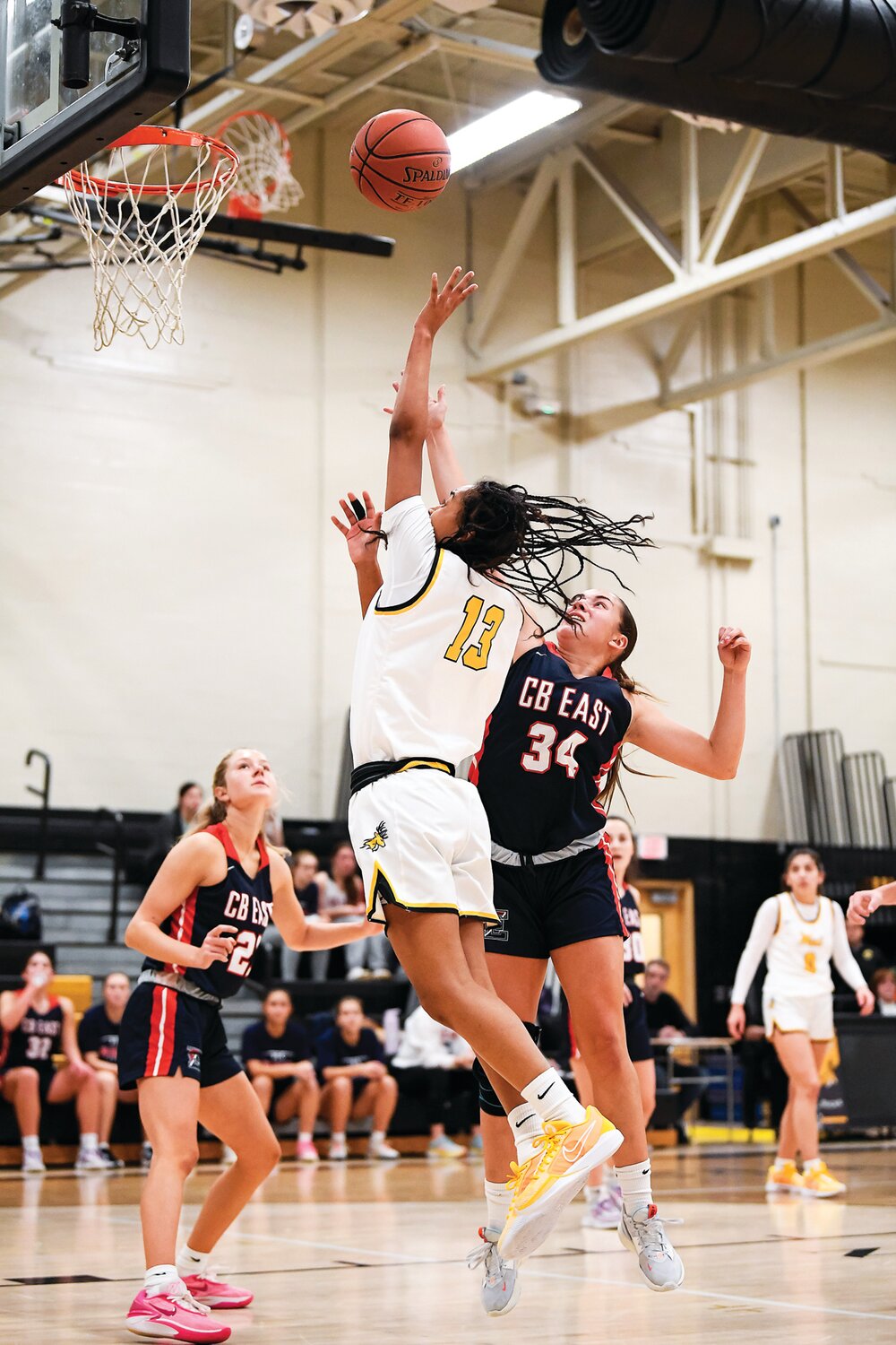 Central Bucks East’s Aniya McDaniel gets a shot off around Central Bucks East’s Chantal Van Dongeren.