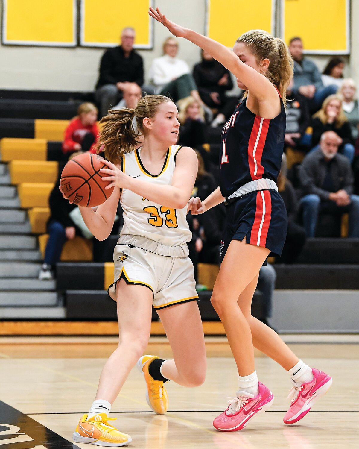 Central Bucks West’s Scarlett Baumgardner has her path to the bucket blocked by the defense of Central Bucks East’s Natalie Berndt.