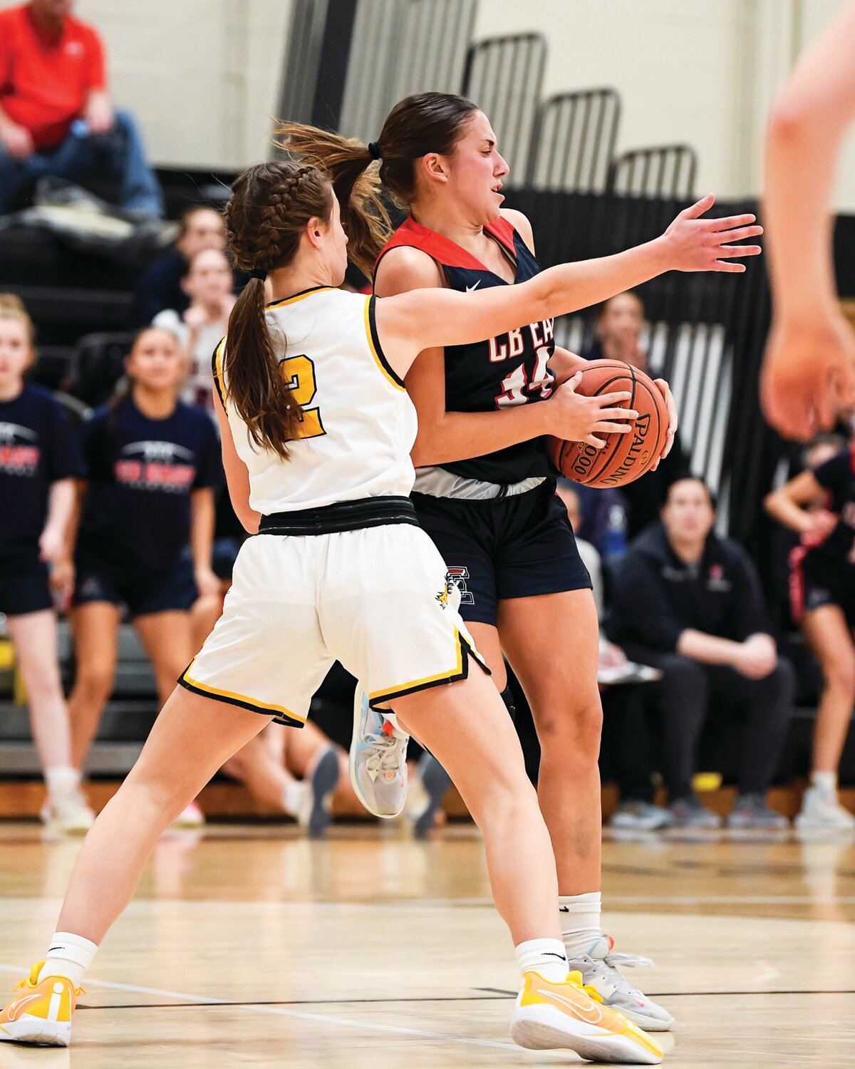 Central Bucks East’s Chantal Van Dongeren snags a rebound in front of Central Bucks West’s Erica Madden during the second quarter.