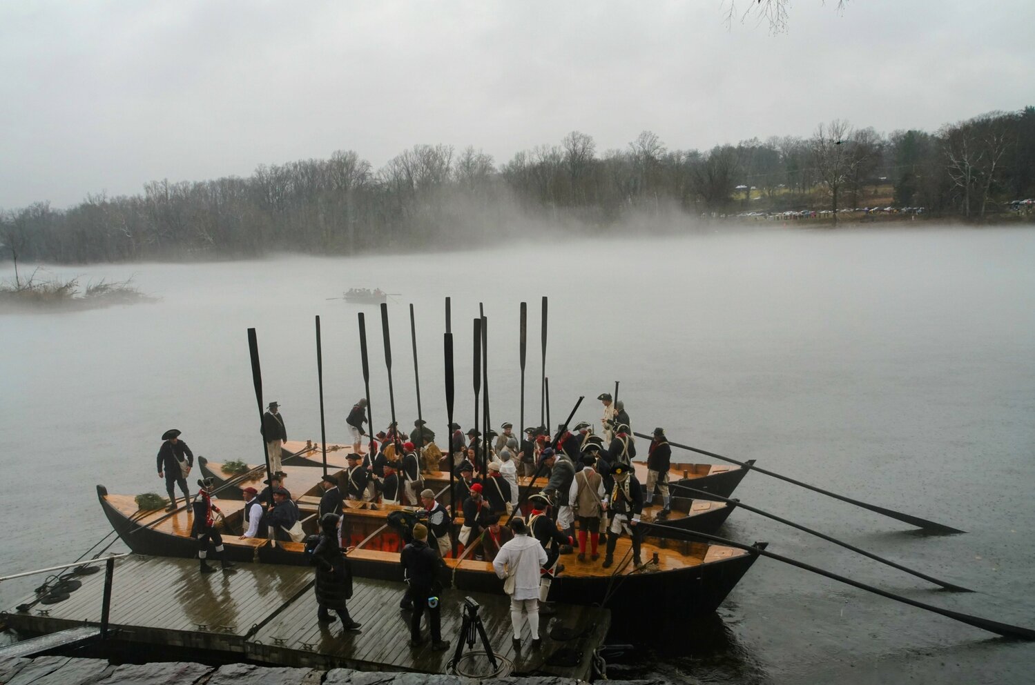 As the lead Durham boat approaches the middle of the Delaware River, three additional craft prepare for launch.